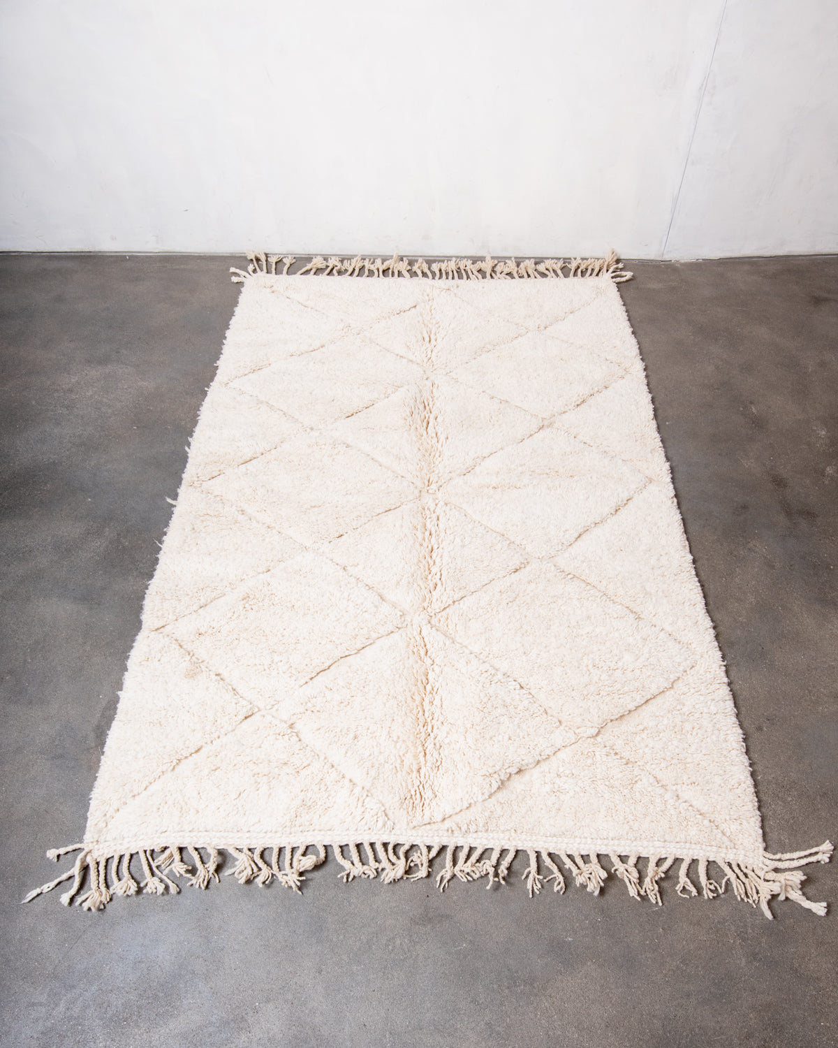 Modern, designer, handcrafted Berber rug from Morocco. Beniourain carpet with minimalist design, natural wool pile and a fluffy texture.